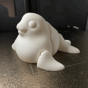 Filhote de Foca Articulado: Doçura e Movimento em suas Mãos